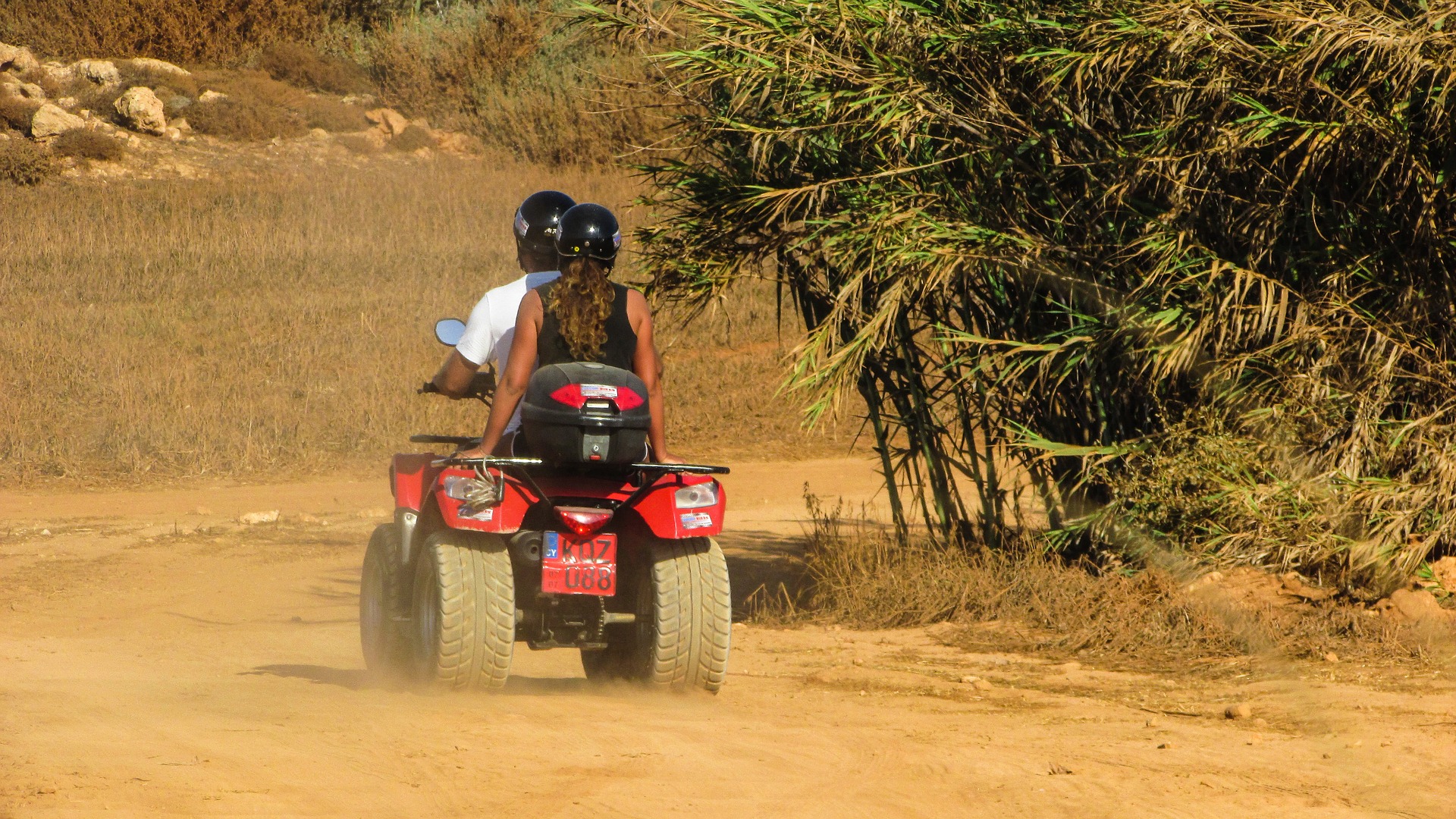 Two people on a quad bike