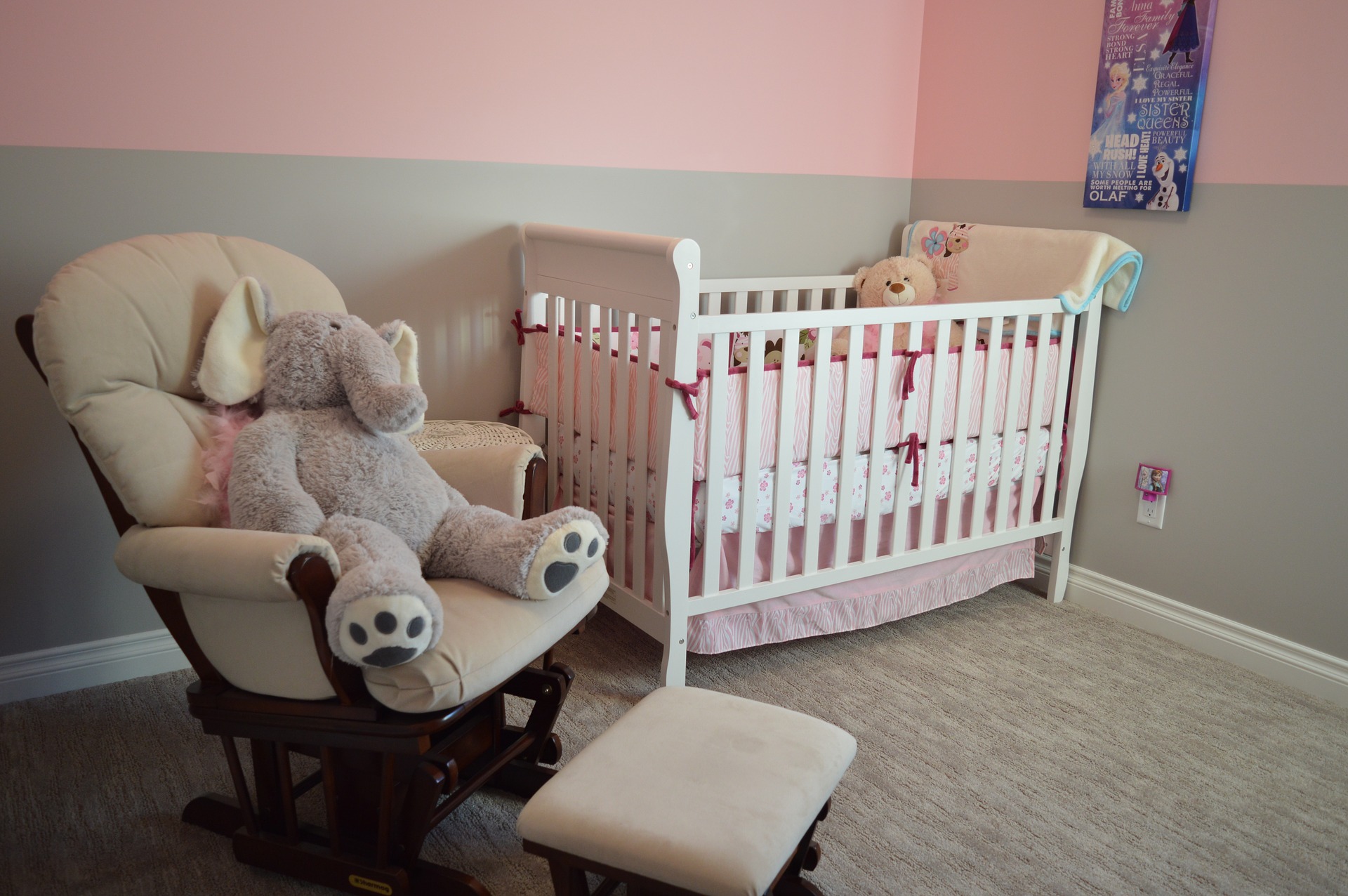 A nursing chair and a baby's cot in a nursery