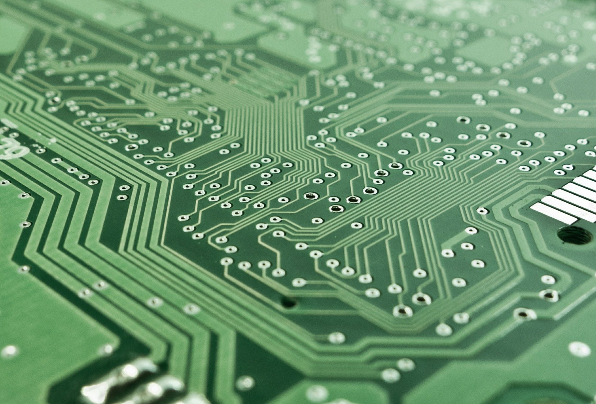 A close-up image of a green electric circuit board